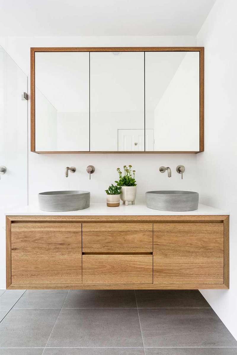 Timber Vanity And Light Grey Concrete Basins In Bright Bathroom