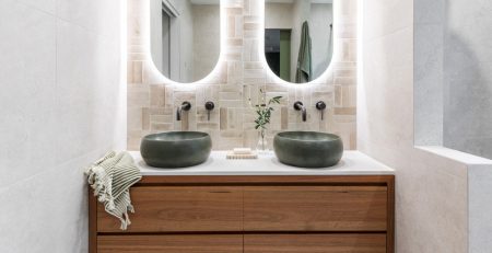 Double timber vanity with green sinks and pill mirrors