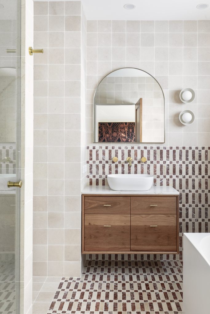 Bathroom with a Keys Crema and Merlot marble mosaic floor and timber vanity